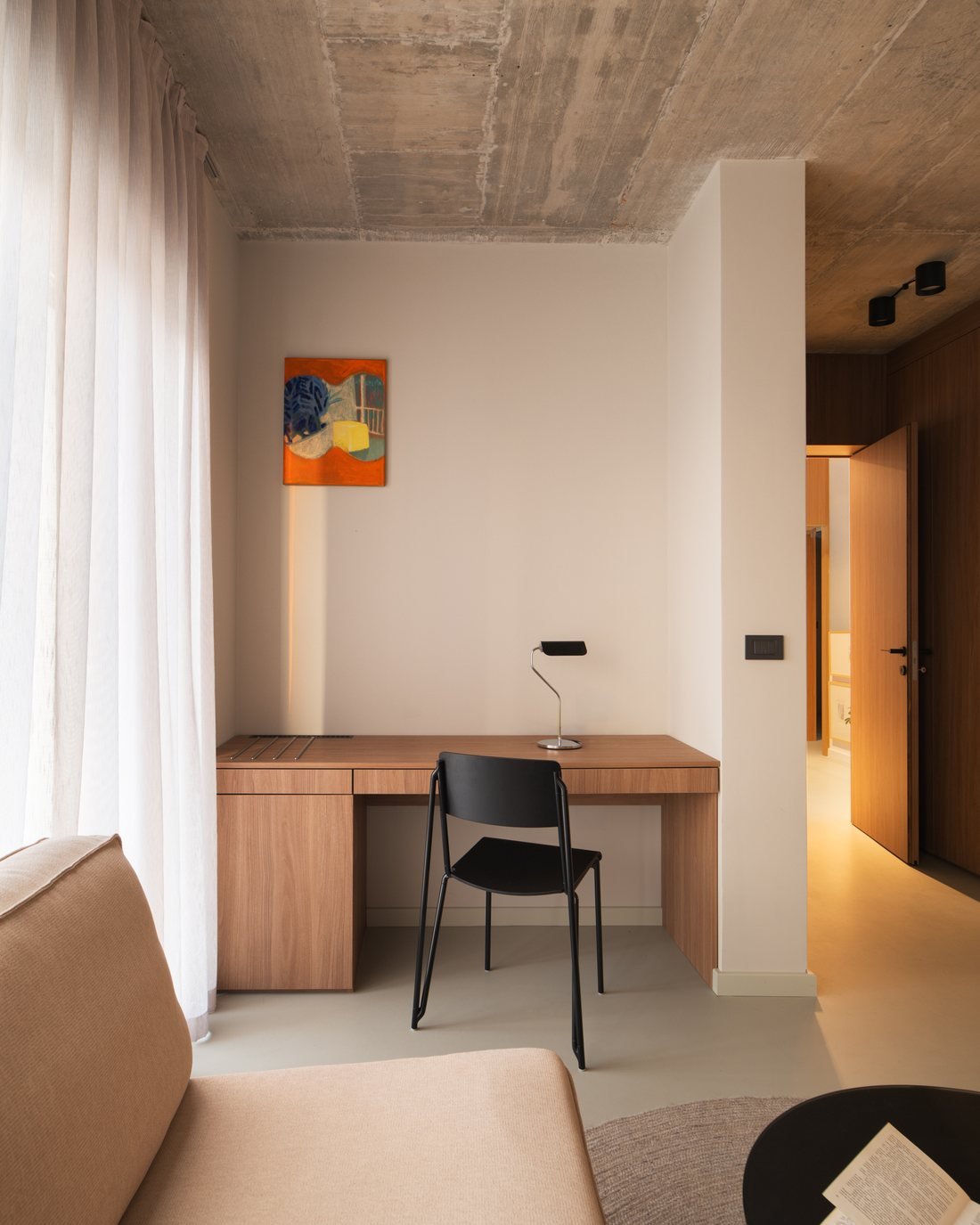 Arc House: interior with timber joinery and artwork